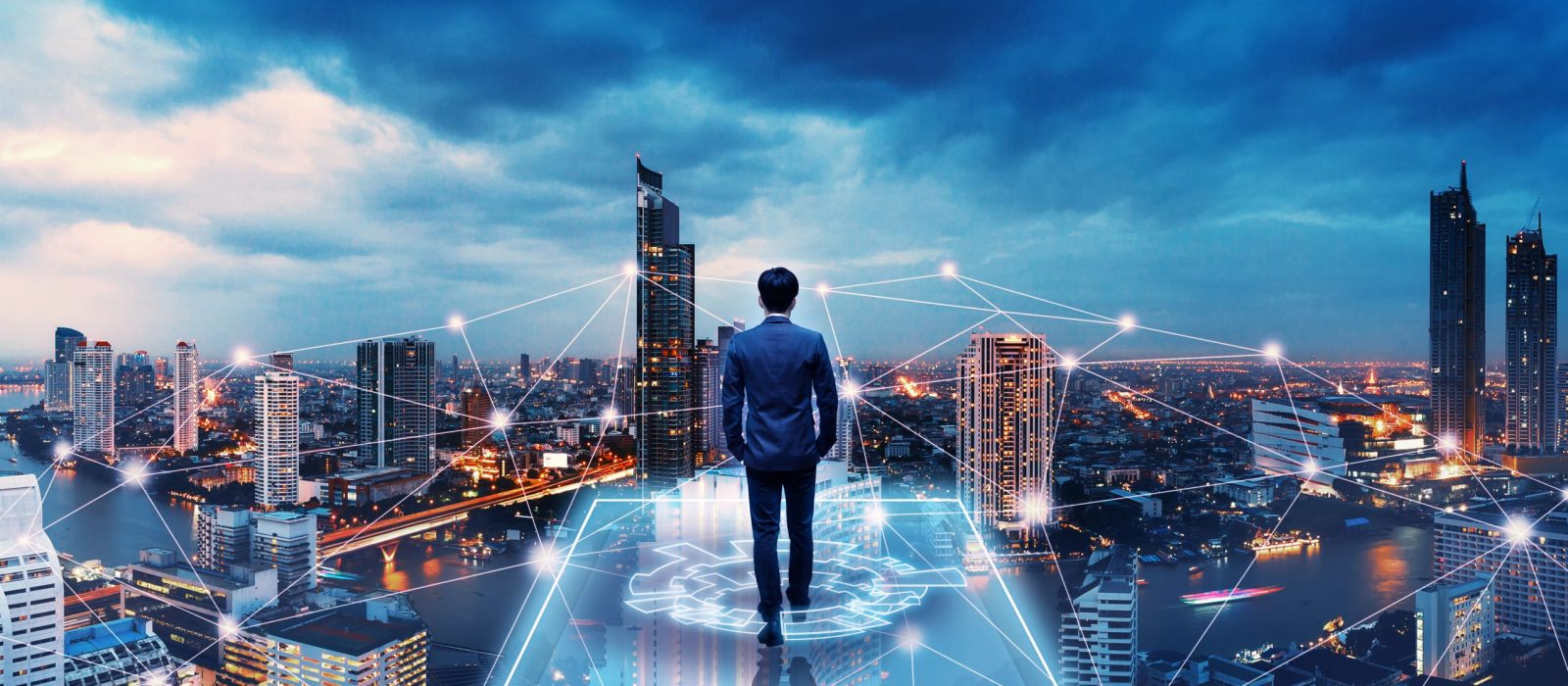 Business technology concept, Professional business man walking on future network city background and futuristic interface graphic at night, Cyberpunk color style